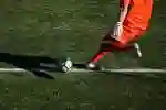 Close-up of a goalkeeper taking a goal kick