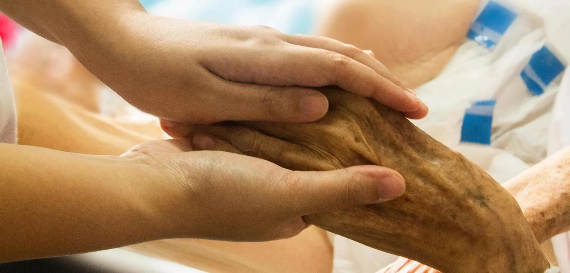 Close up of people holding hands