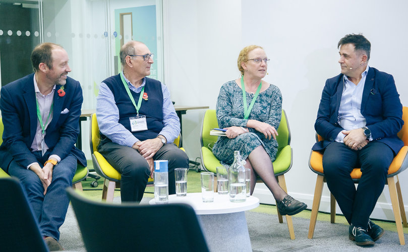 Jane Cooper of RenewableUK on an Industry Panel at our CDT Conference four people on a panel, three men and one woman seated around a small table with water and glasses in front of them