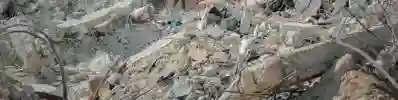 rubble and steel cables, all that remains of a building following an attack
