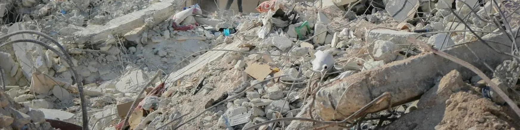 rubble and steel cables, all that remains of a building following an attack