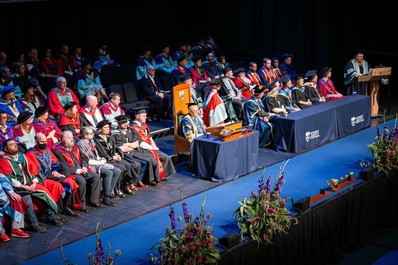The stage at a graduation ceremony with an honorary graduate being celebrated