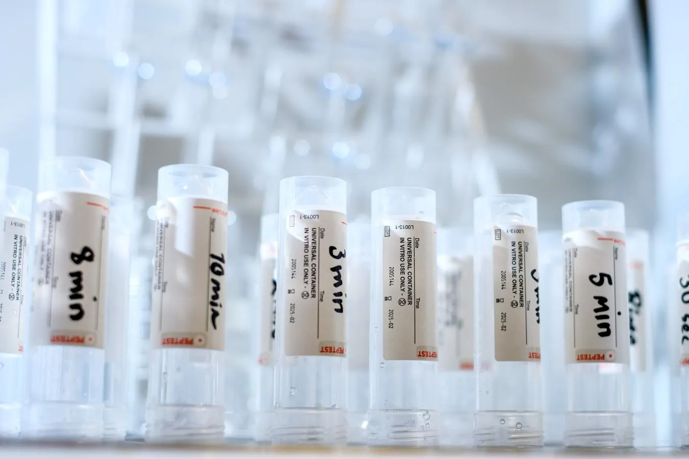 row of labelled laboratory samples in clear plastic tubes