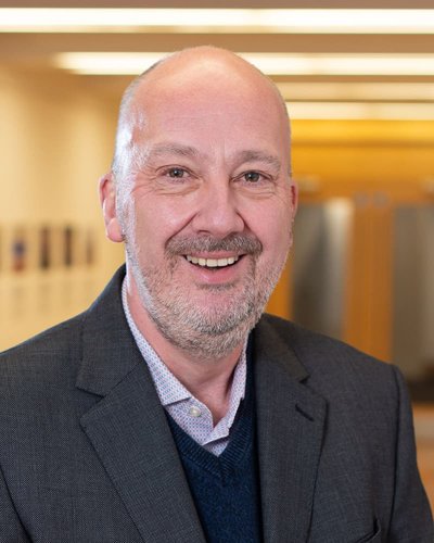 portrait of bearded man looking at camera and smilin