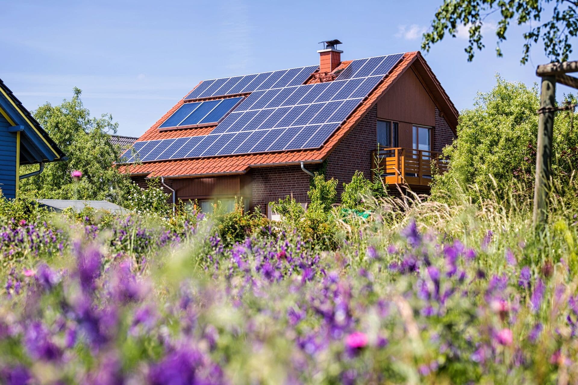A house with solar panels on a sunny day.
