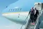 President Trump alighting from a plane