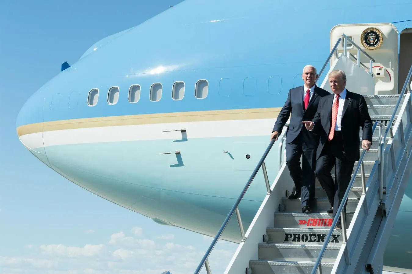 President Trump alighting from a plane