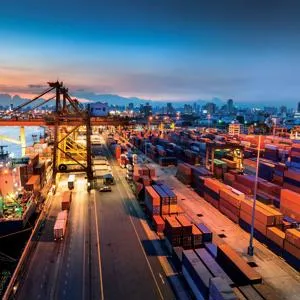 Busy port at night with containers and cranes