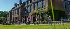 Venn Building with people walking past