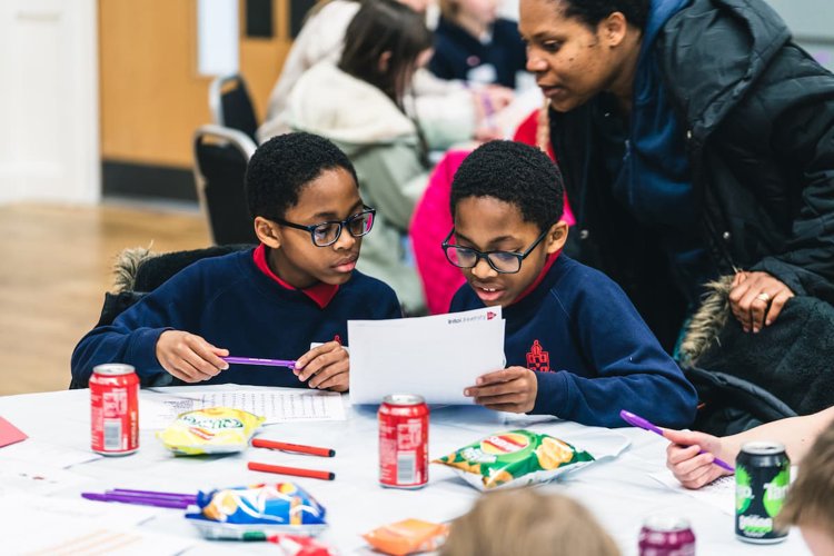 Children and parents at an IntoUniversity session
