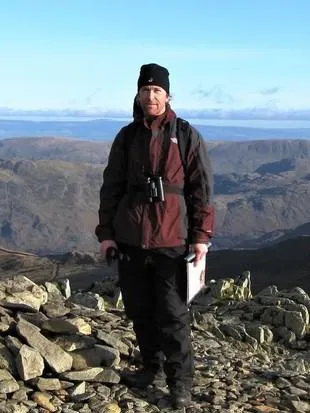 Dr Andy Nunn at the summit of a hill