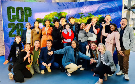 EEI staff and NYT members gather in front of a COP26 banner