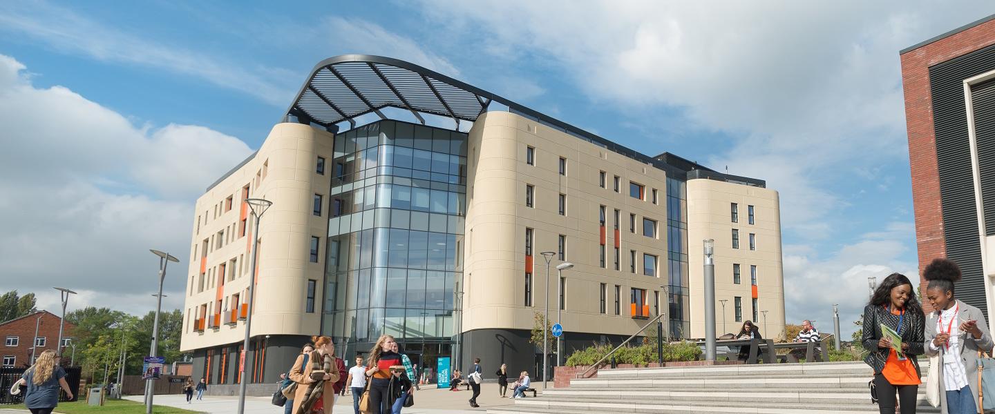 Students outside Allam Medical Building and Library UNI-6767