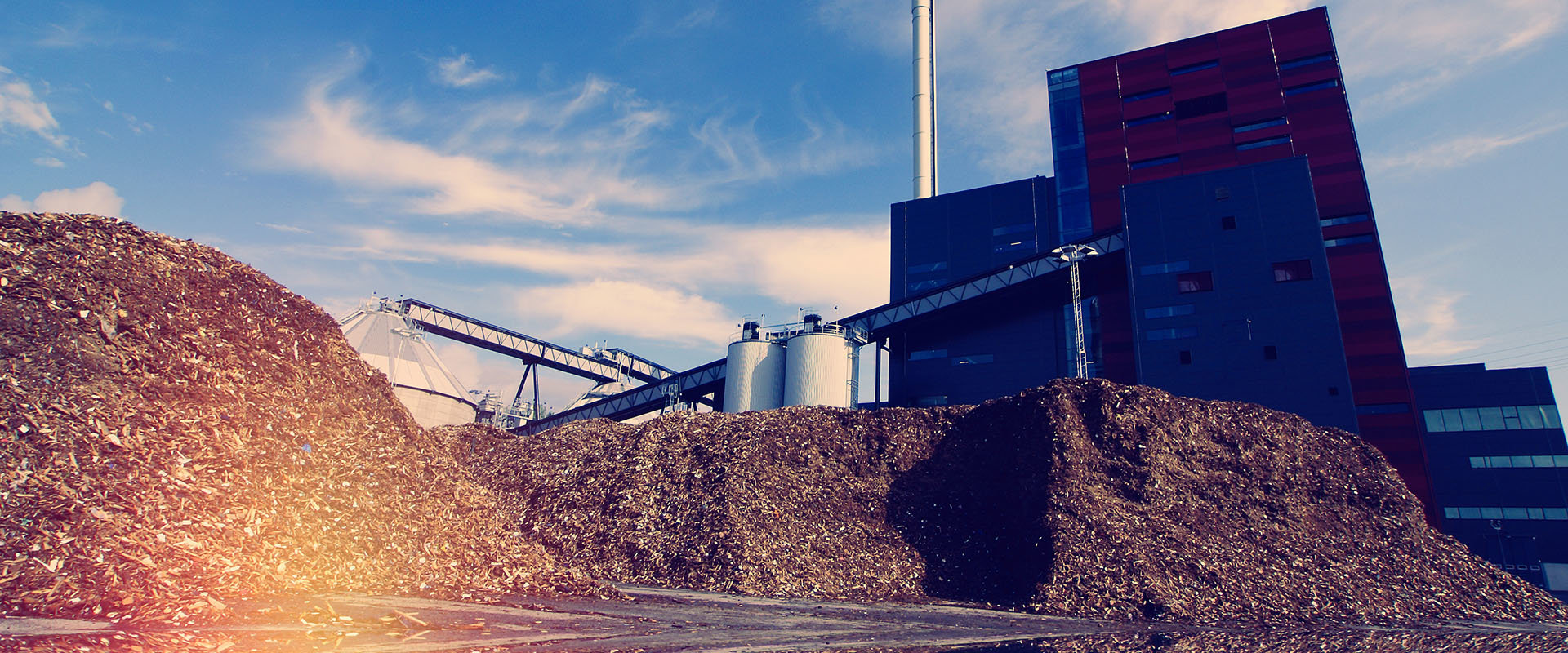 Image of biomass outside of a industrial building