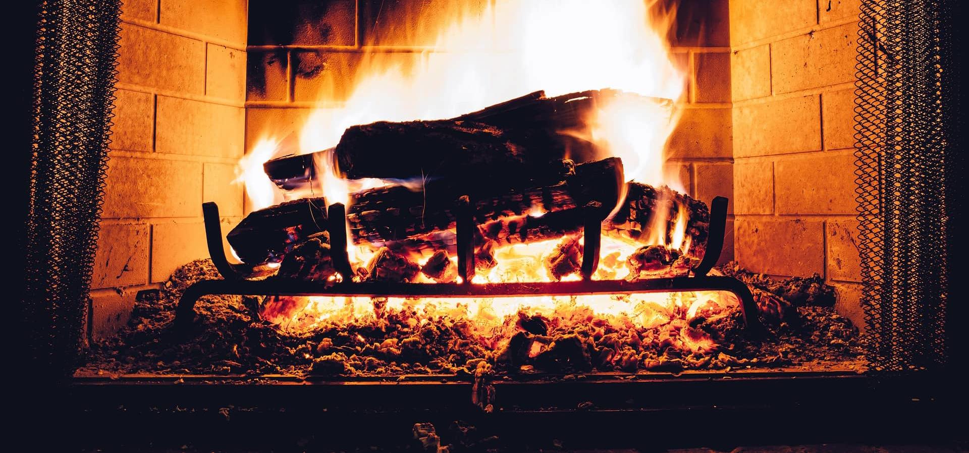 Blazing log fire in a fireplace