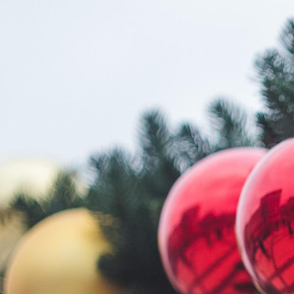 gold christmas baubles on a tree