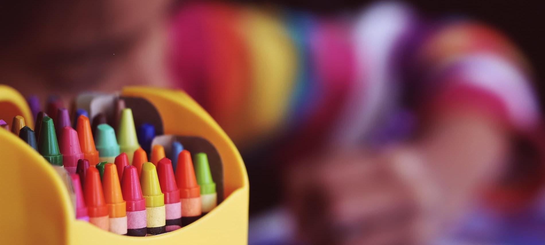 Child drawing with crayons