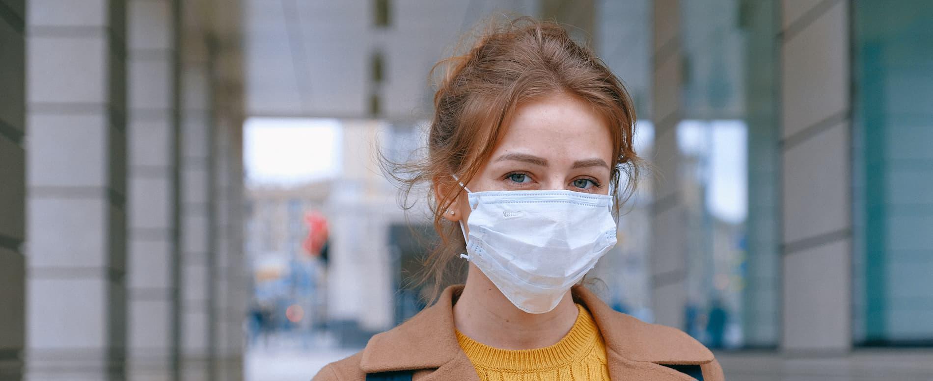 Woman wearing surgical face mask