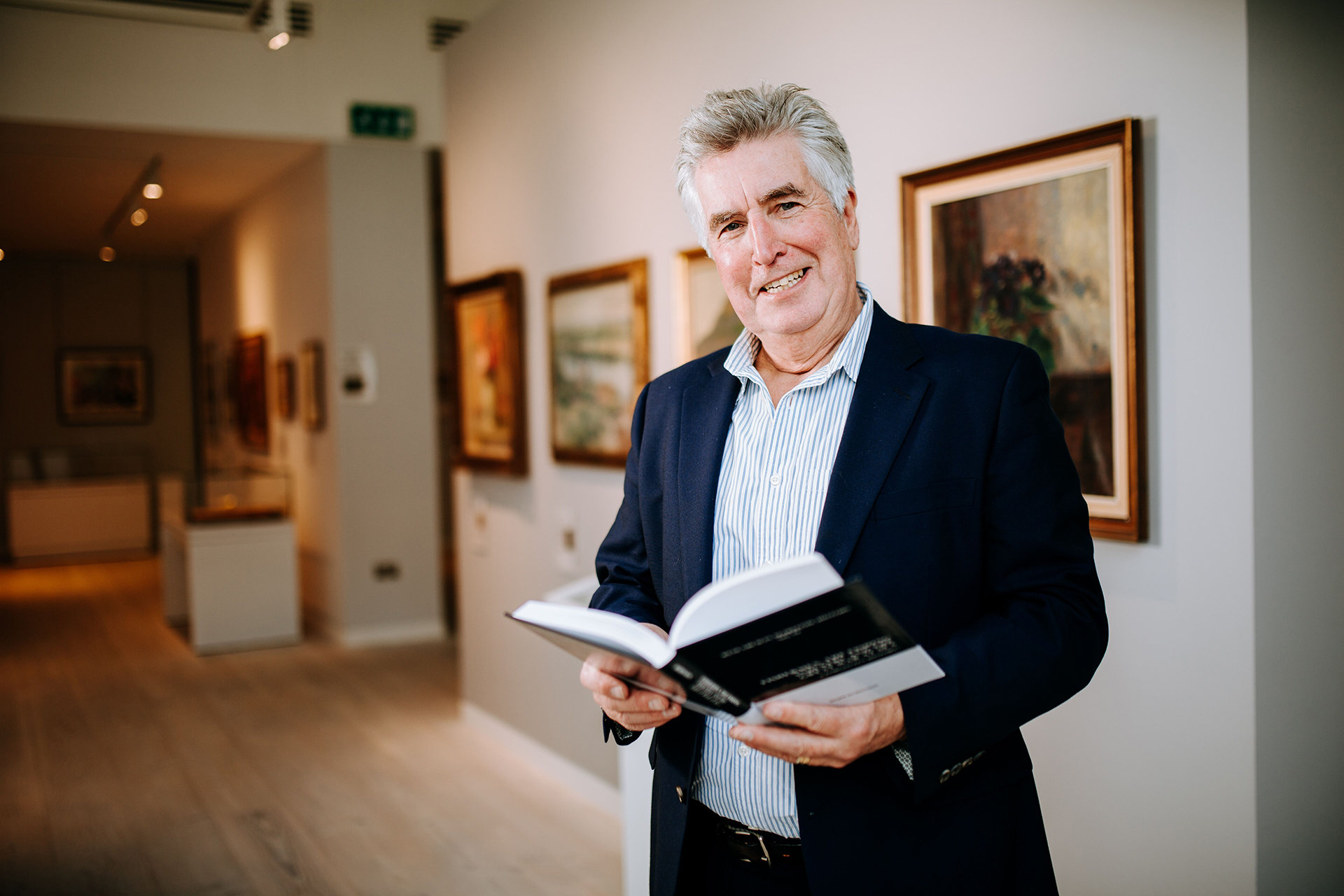 Dr Robb Robinson in University Art Gallery with New Publication