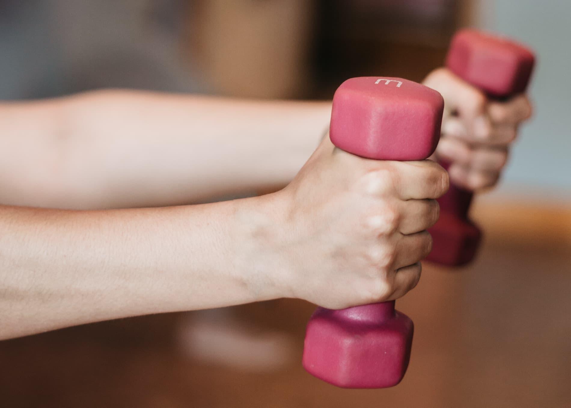 Lifting weights during an exercise class