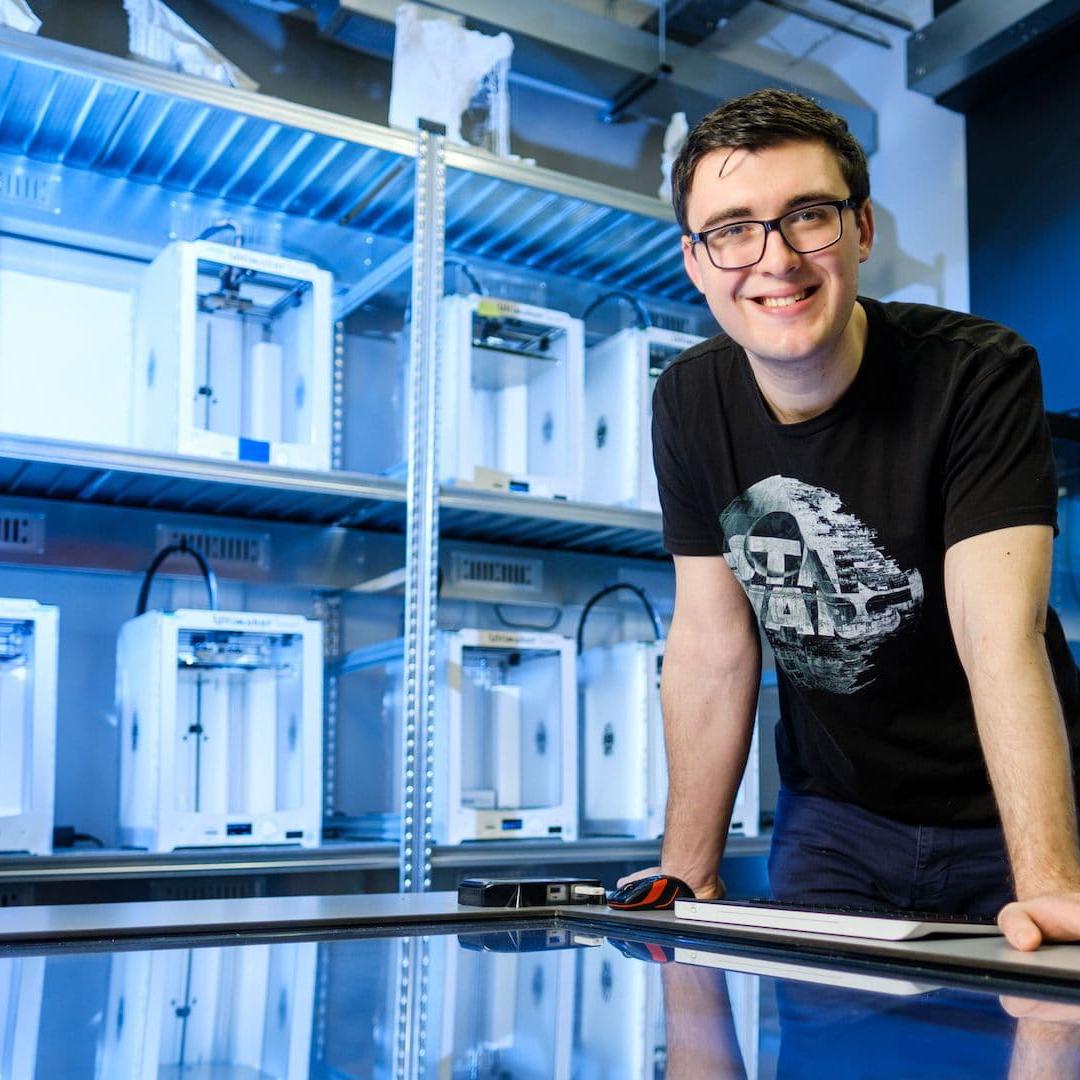A student in the FabLab with 3D printed equipment