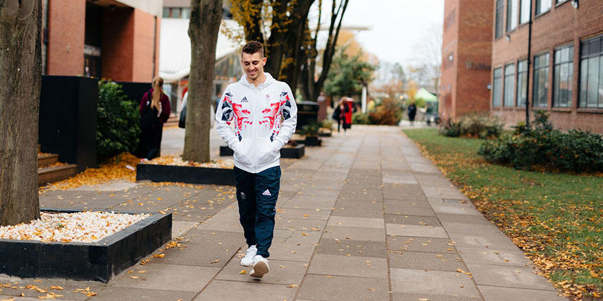max whitlock walking through campus