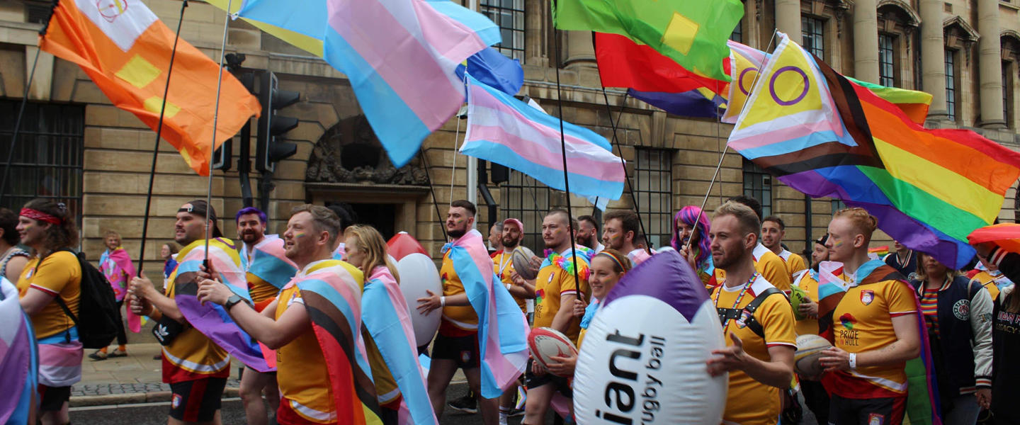 rugby team parading through town for LGBTQIA+