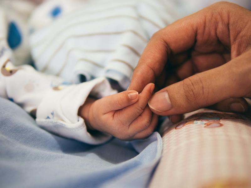 stock photo of baby and parent hands