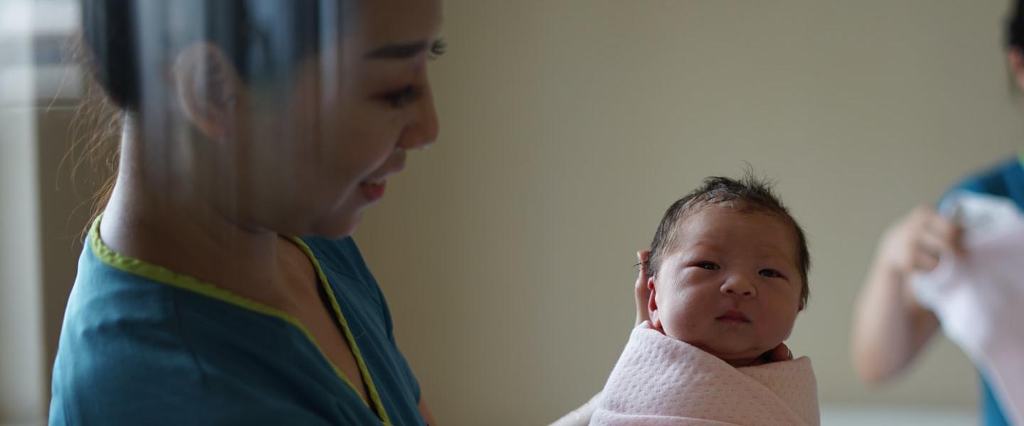 stock photo of midwife and baby